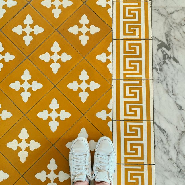 Newly laid floor tiles being checked after renovation